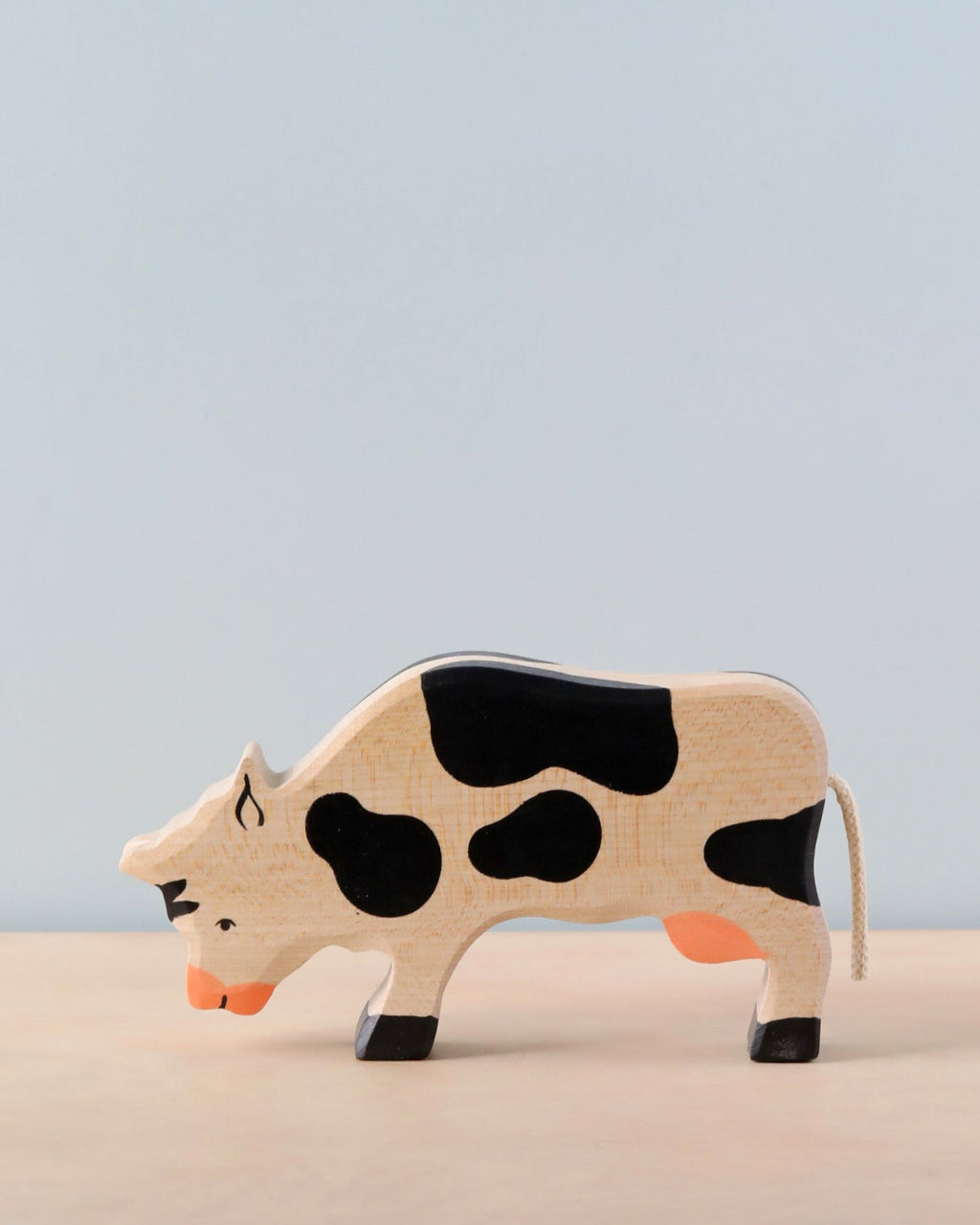 Holztiger Grazing Black Cow