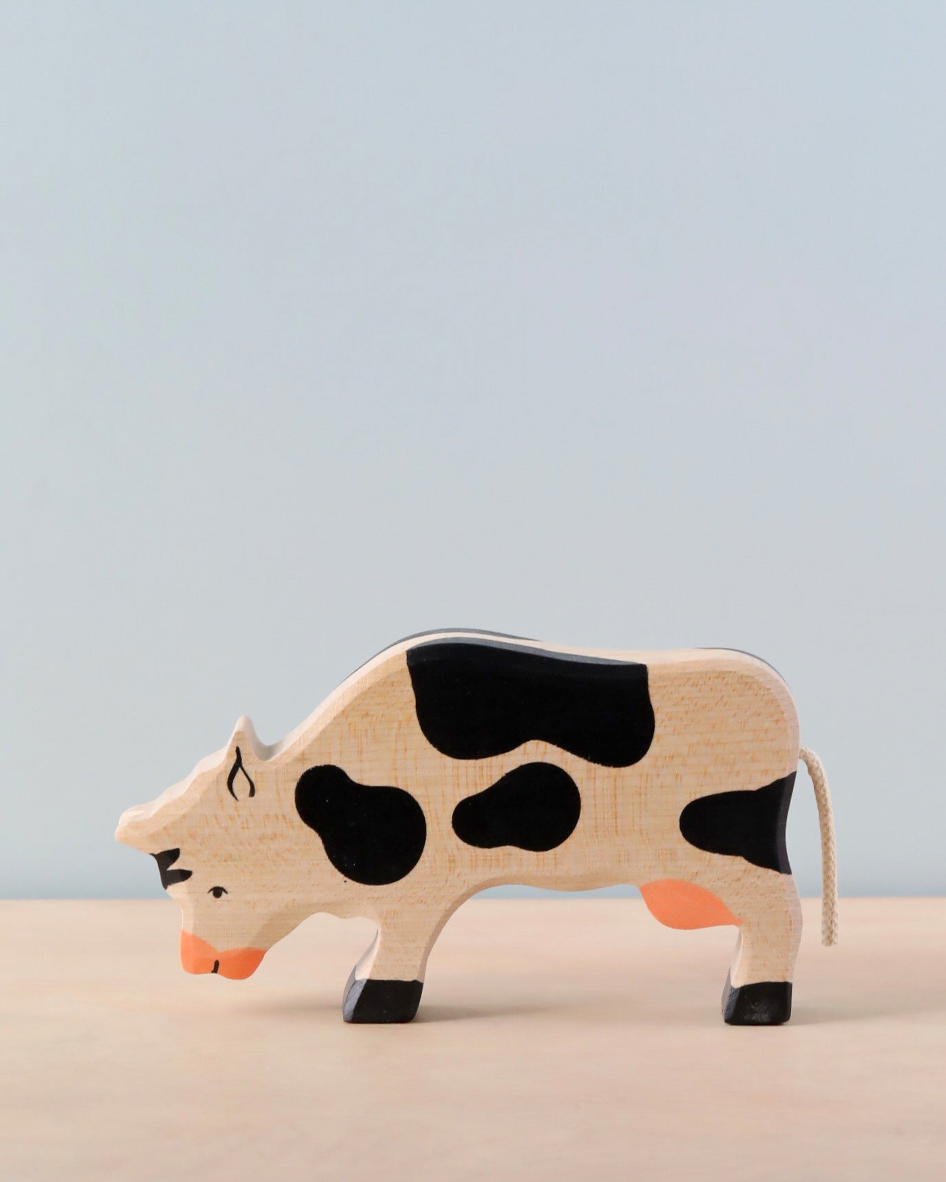 Holztiger Grazing Black Cow