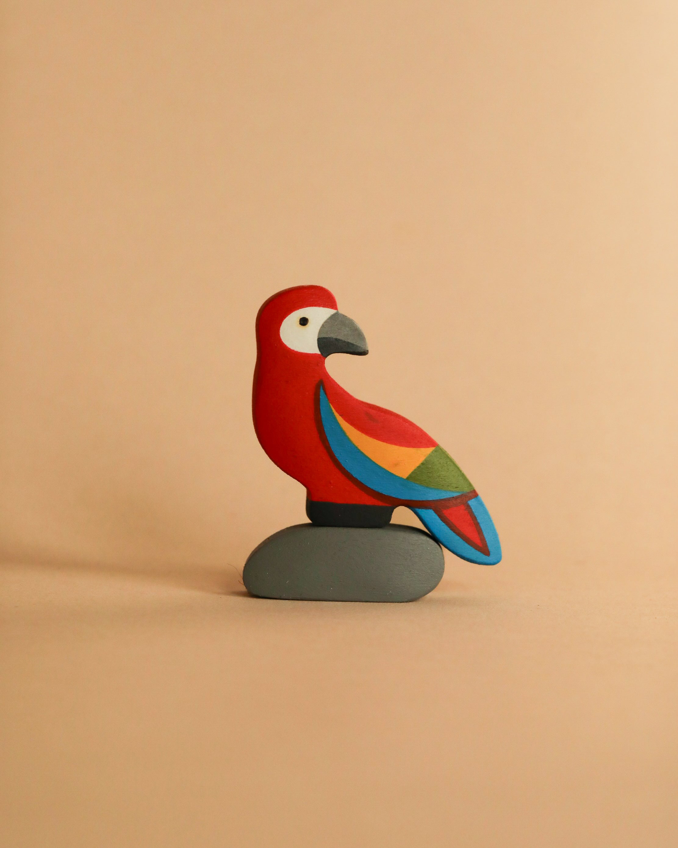 Handmade Wooden Parrot On A Rock