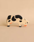 Holztiger Grazing Black Cow