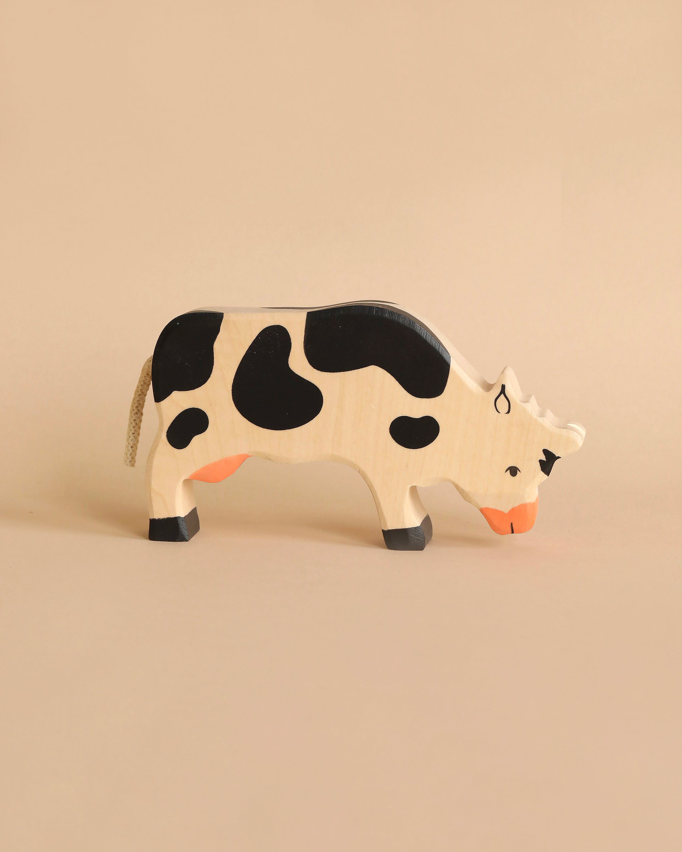 Holztiger Grazing Black Cow